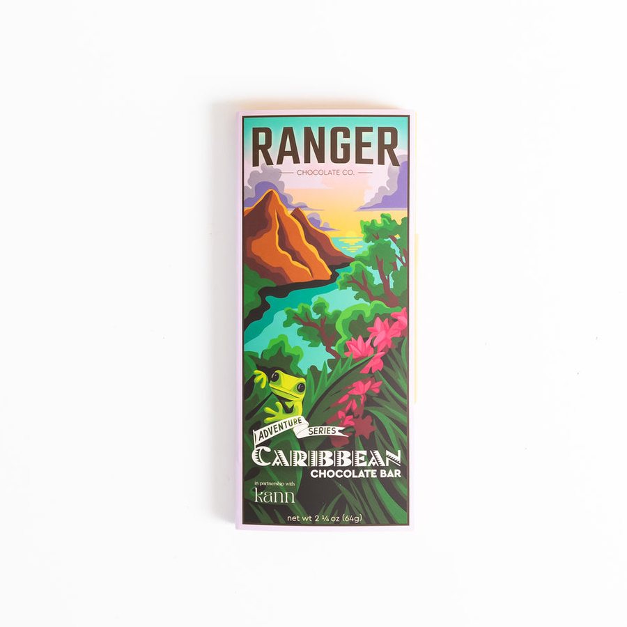 A Ranger Caribbean Chocolate Bar with colorful artwork of a tropical landscape