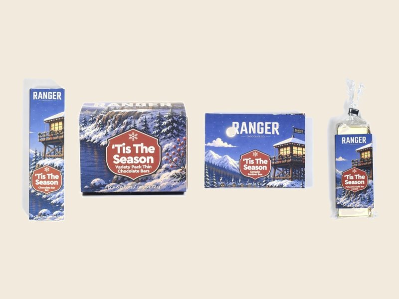 Four Ranger ’Tis the Season gift sets in winter lookout-tower artwork: an Explorer bar 3-pack, a variety pack, a sampler bonbon box, and Pistachio Gold Bars